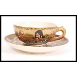 A Japanese Meiji period Satsuma ware cup and saucer having decoration of Elders / Immortals and