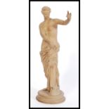 A 19th Century clay / terracotta Grand Tour figurine of a semi nude classical maiden raised on