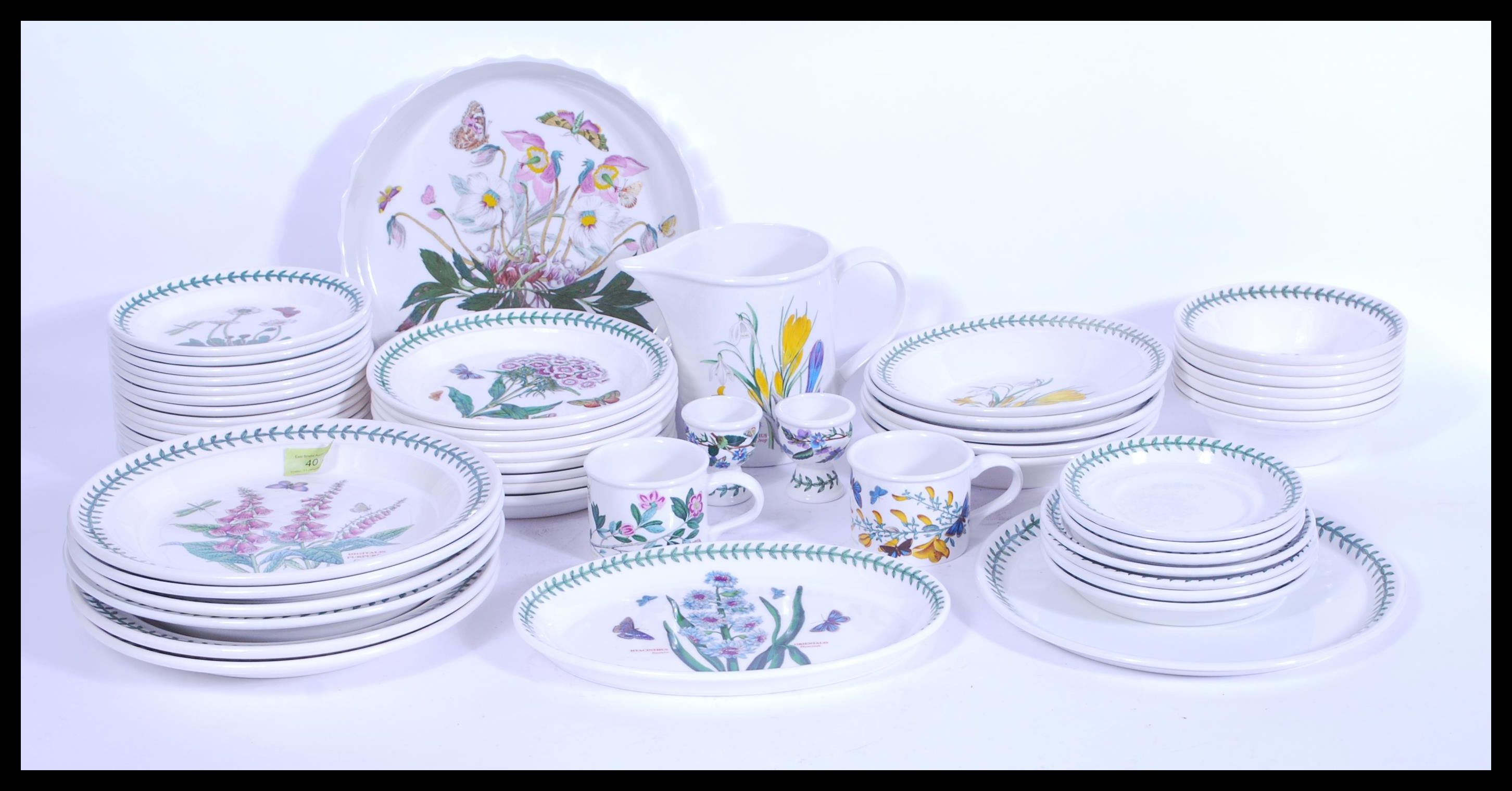 A collection of Portmeirion botanic garden table wares, to include water jug, tray, pie dish, two