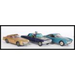 Three vintage Corgi & Politoys diecast model vehicles to include; Man From U.N.C.L.E Oldsmobile