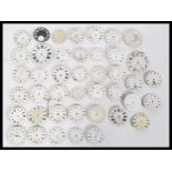 A good selection of pocket watch faces, most being white enamelled, some with subsidiary dials, some