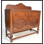 A 20th Century Art Deco 1940's oak sideboard, with galleried back with central carved fan design,