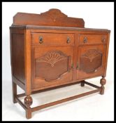 A 20th Century Art Deco 1940's oak sideboard, with galleried back with central carved fan design,