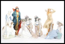 A collection of Nao (Lladro) and Royal Doulton ceramic figurines to include CL3982, CL4008, Nao