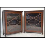 A pair of 19th century mahogany library bookcase cabinets. Each raised on stub legs with full length