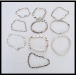 A collection of sterling silver bracelet chains to include a rope twist chain with lobster claw