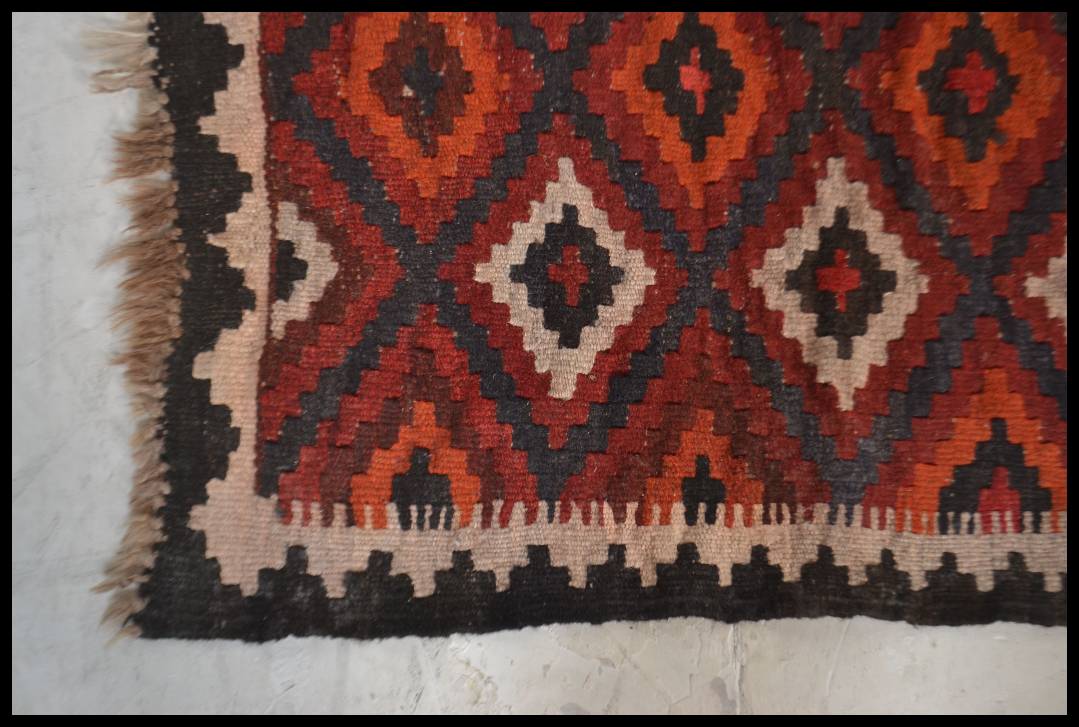 A 20th century  Islamic / Persian rug of small form with geometric patterns and triangular - Image 3 of 4