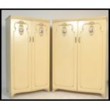 A pair of 20th century  Louis 16th style painted shabby chic ladies and gents wardrobes having