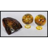 A group of unusual taxidermy scorpions preserved in faux amber lucite consisting of two balls on