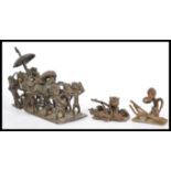 A selection of West African Ashanti tribal figurines including a large group scene depicting a