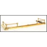 A 19th century Victorian brass adjustable kerb fire fender guard having metamorphic action and