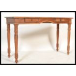 A 20th Century antique Victorian style hardwood side table / writing desk, flared top over two