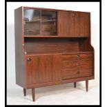 A vintage retro 20th century faux rosewood veneered highboard sideboard display cabinet by Greaves