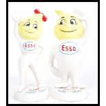 A pair of vintage cast iron advertising point of sale Esso money banks in the form of lemon headed