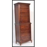 A mid 20th Century mahogany chest on chest / chest of drawers, having twelve drawers with turned