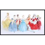 A collection of Royal Doulton ceramic figures to include Adrienne HN2304, Winter HN5314, Autumn