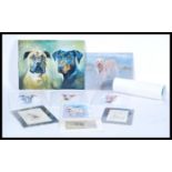A selection of contemporary prints and paintings of dogs and cats to include a signed print by