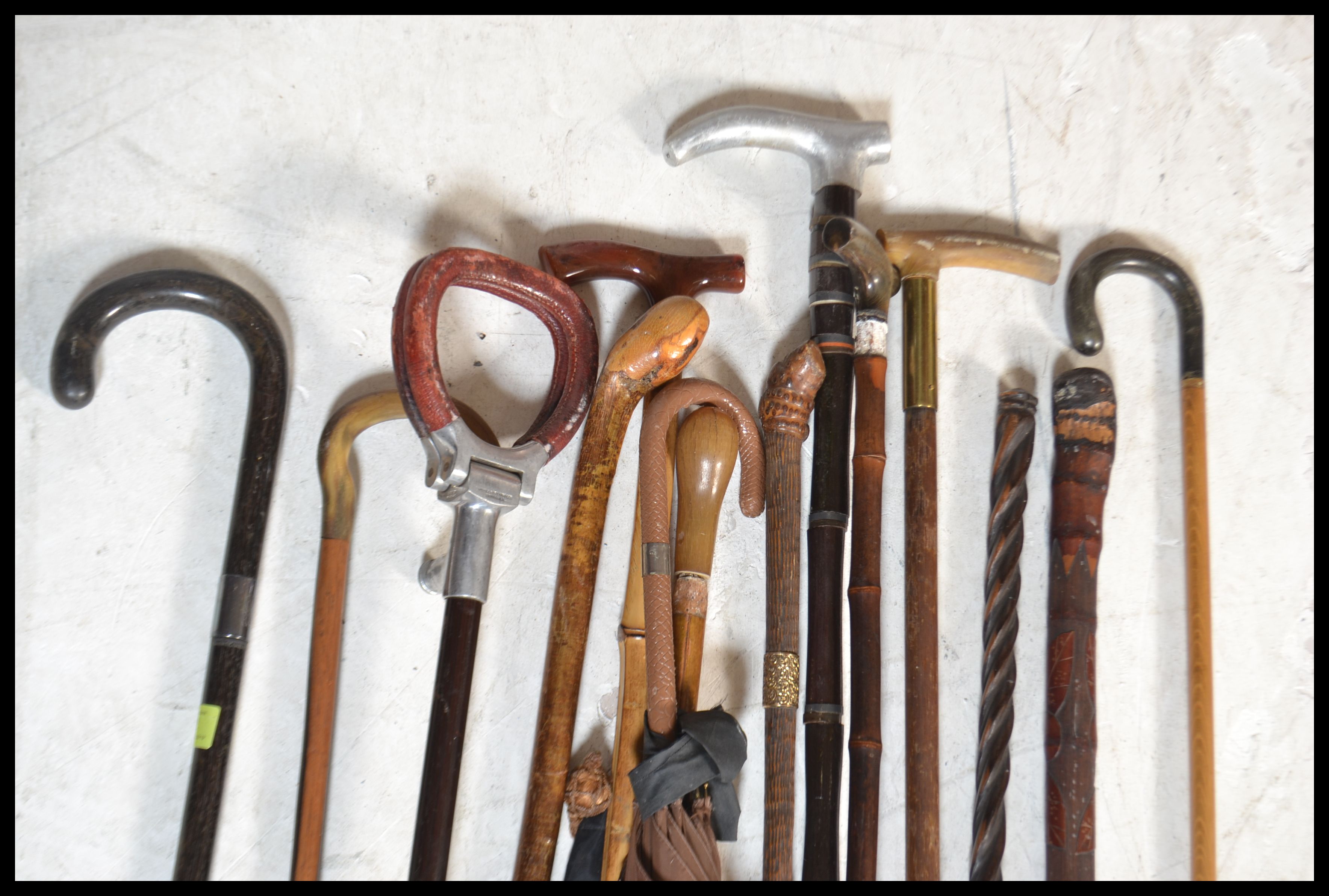 A collection of various designed walking canes dating from the late 19th / early 20th Century to - Image 2 of 4