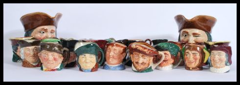 A large collection of vintage early to mid 20th century Royal Doulton Toby Character jugs to include