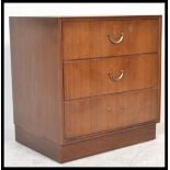 A mid 20th century Meredew Furniture teak wood pedestal chest of drawers with brass swing handles to
