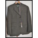 A vintage mid 20th Century Dunn and Co gentleman's tweed / check two piece suit in fantastic