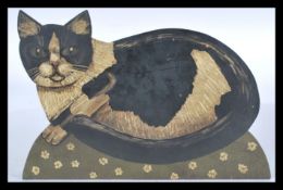 A 20th century carved wooden panel painting of a cat on domed floral base. Hand painted with