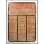 A vintage retro 20th century large First Aid board on card featuring 1970's instructions and