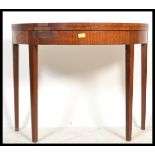 A 19th century George III mahogany demi lune tea table / games card table. Raised on square tapering