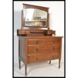 An early 20th Century Edwardian mahogany dressing table chest of drawers, swing mirror over three