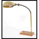 An early 20th century Industrial anglepoise brass lamp with goose neck adjustable neck, cast iron