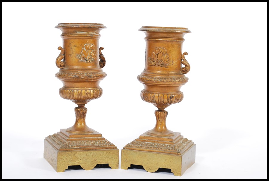 A pair of 19th century bronze urns raised on square bases with decorations of swags and ribbons with - Image 2 of 9