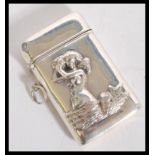 A sterling silver vesta match case having relief decoration depicting a mermaid. Stamped sterling