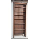 A tall Victorian oak 6ft + open window library bookcase cabinet having drawer base with tall shelves