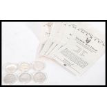 A collection of six  Silver Half Dollars dating from 1893 - 1982 in capsules with certificates to