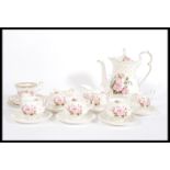 A Royal Albert fine bone china English tea service in the Mary Louise pattern consisting of a