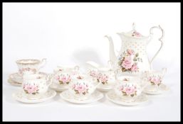 A Royal Albert fine bone china English tea service in the Mary Louise pattern consisting of a
