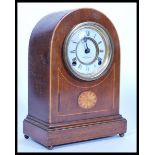 An early 20th Century Edwardian mahogany marquetry inlaid mantel bracket clock having a white enamel