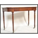 A Georgian 19th century mahogany console hall table being raised  on turned tapering legs with