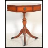 A Regency revival yew wood octagonal pedestal drum table of good quality being raised on castor
