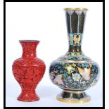 A vintage 20th Century Chinese Cloisonne vase on copper along with a Cinnabar lacquer baluster vase.