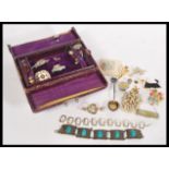 A collection of vintage costume jewellery contained within a vintage jewellery box. Includes