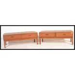 A pair of matching retro 20th Century teak wood Danish inspired low cabinets, each cabinet having