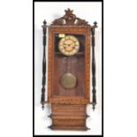 A 19th century Victorian wall clock having turned