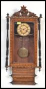 A 19th century Victorian wall clock having turned