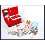 A selection of vintage costume jewellery to include a good selection of vintage brooches including