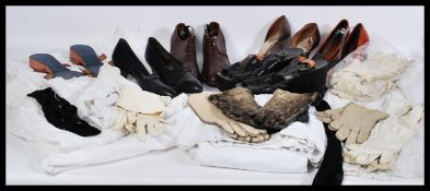 A collection of vintage clothing to include a quantity of early 20th Century kid skin gloves, seal