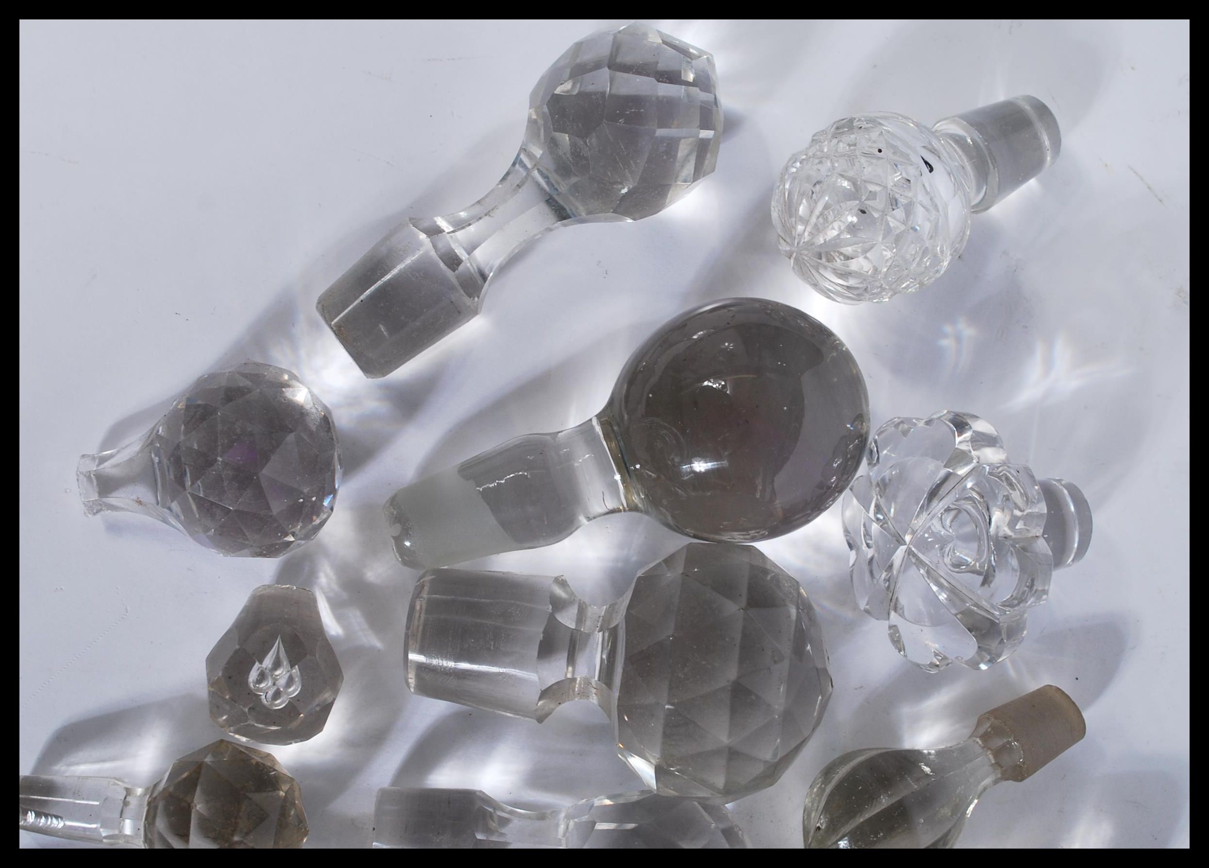 A collection of glass decanter / bottle stoppers of various forms most being crystal cut glass - Image 2 of 4