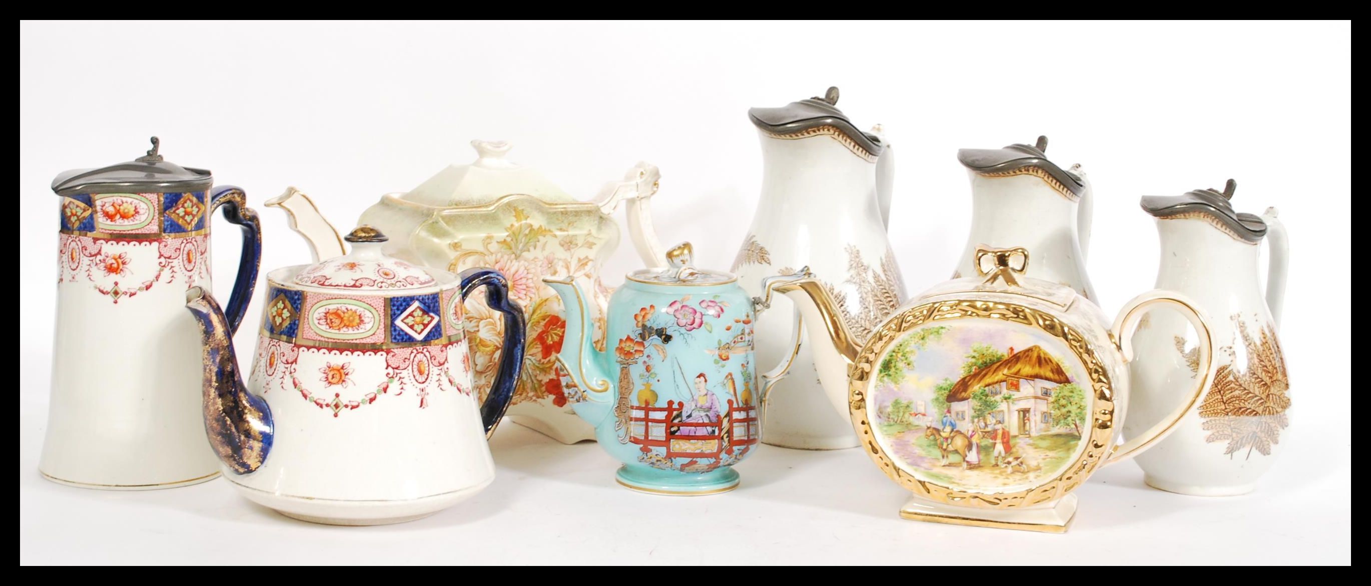 A collection of teapots dating from the 19th Century onwards to include a Victorian teapot of shaped