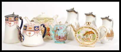 A collection of teapots dating from the 19th Century onwards to include a Victorian teapot of shaped