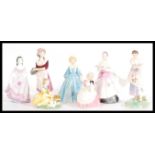 A collection of ceramic figurines to include Royal Doulton Cookie HN 2218, Spring HN 2085, The